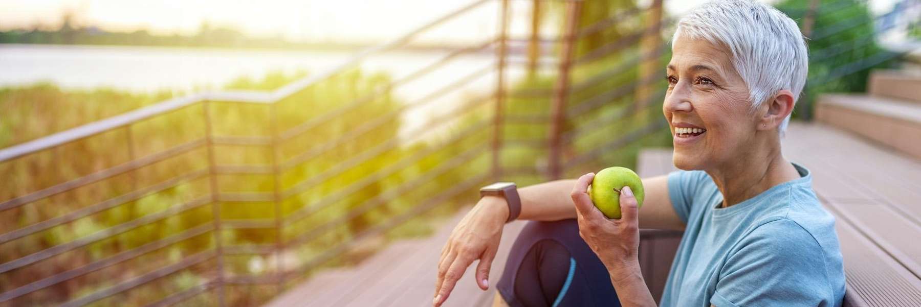 woman eating apple with implants in lower plenty